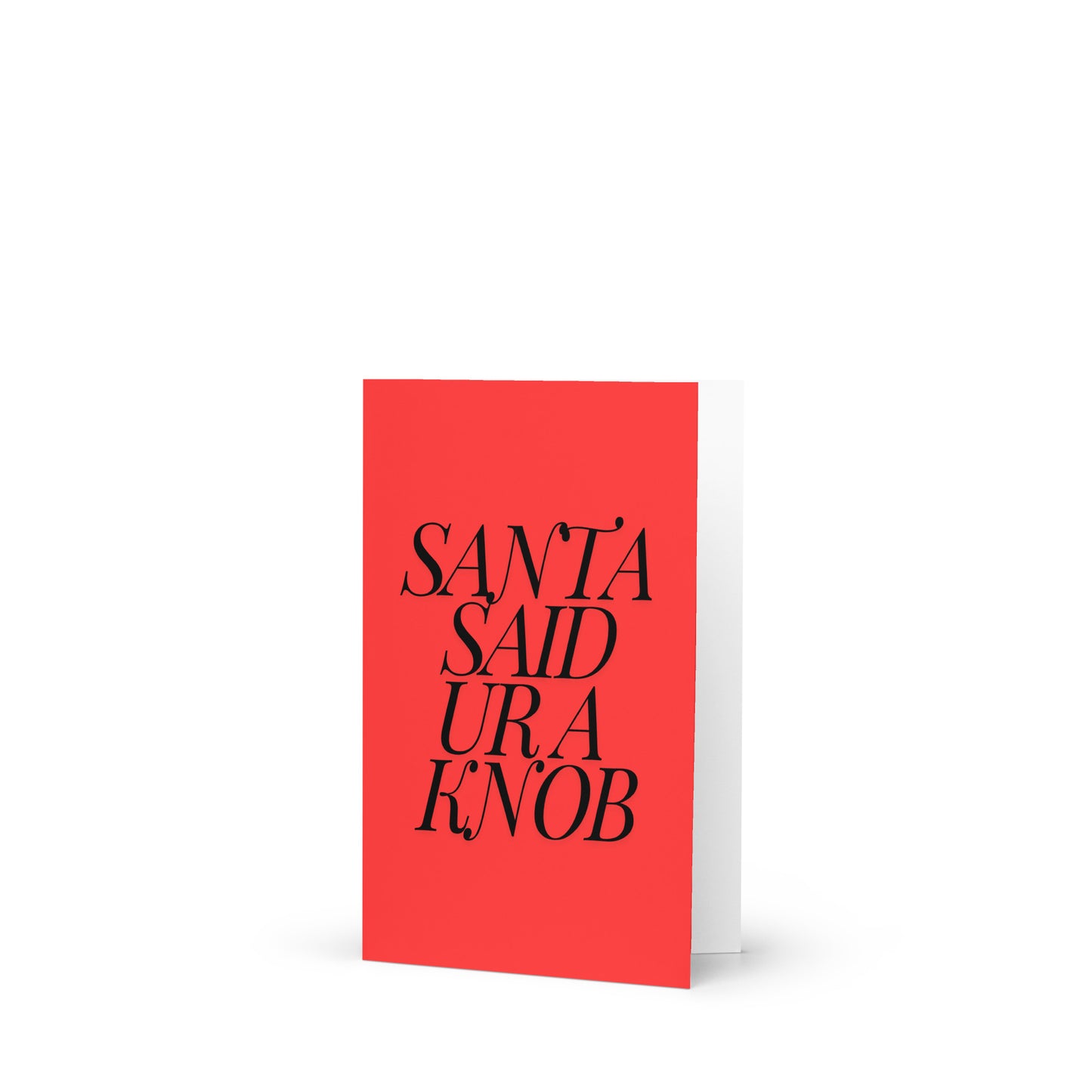 A red card with 'Santa Said Ur a Knob' written in black text and a complimentary envelope.