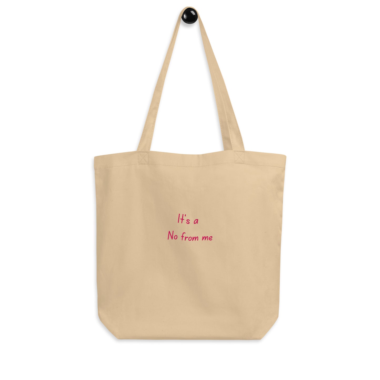 Beige It's a No from Me organic cotton Slogan embroidered eco tote bag on a blank white surface hanging on a hook.