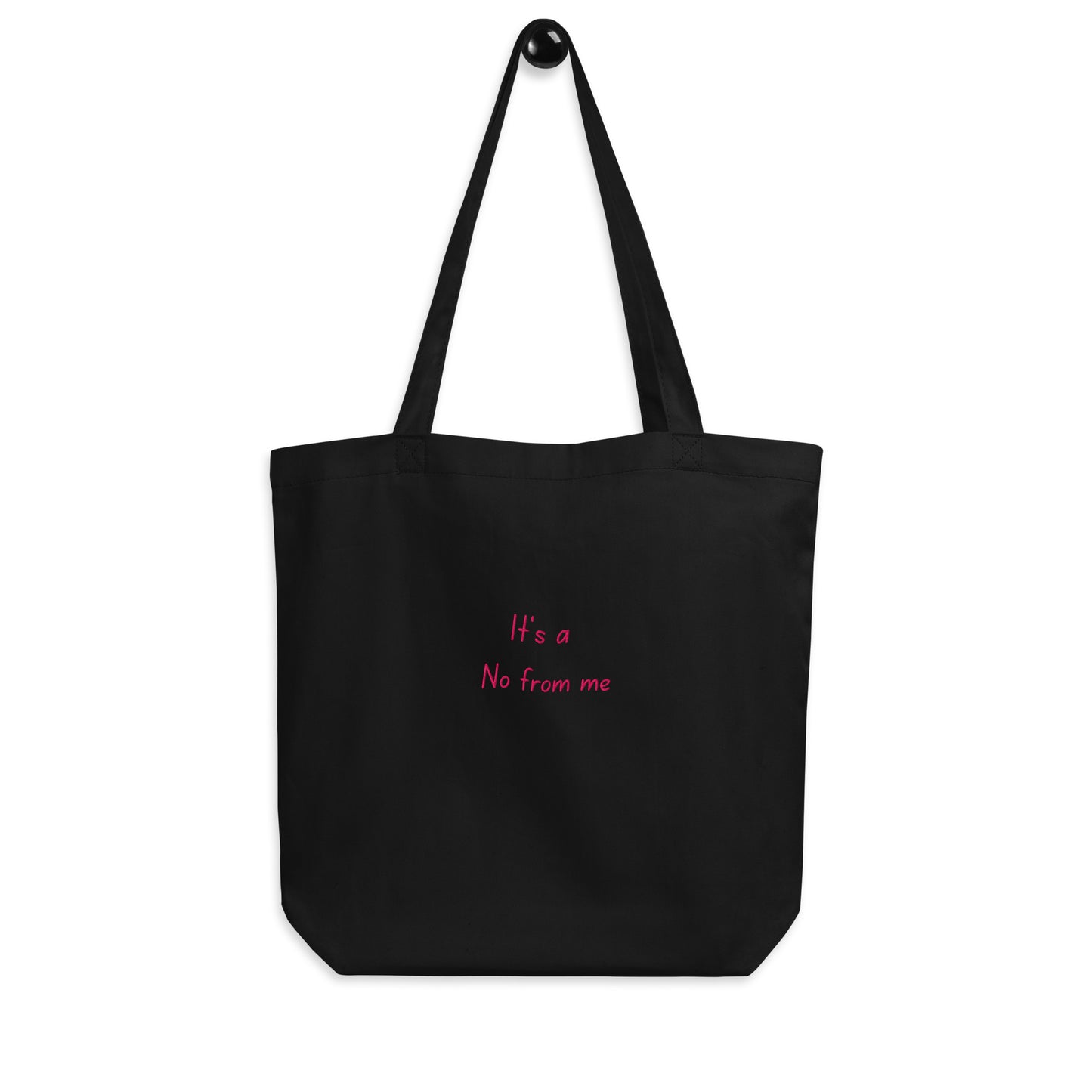 Black It's a No from Me organic cotton Slogan embroidered eco tote bag on a blank white surface hanging on a hook.