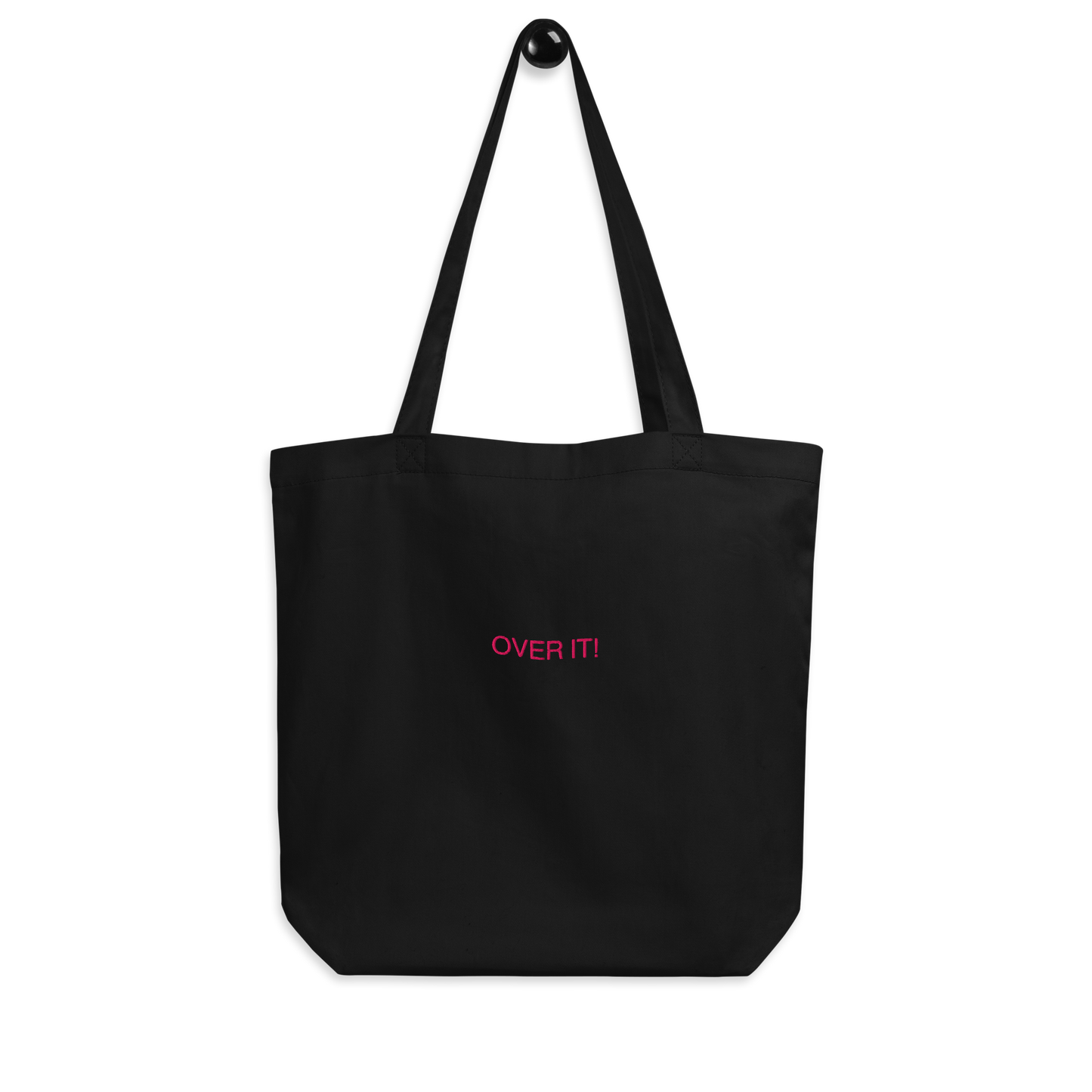 Black Over It slogan embroidered Eco Organic cotton tote bag on a blank surface.