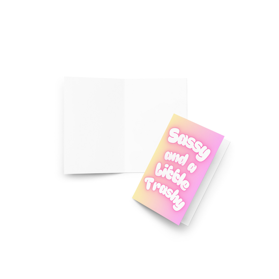 A funny card with the slogan Sassy and a little Trashy in bubble writing at the front in pastel colours.