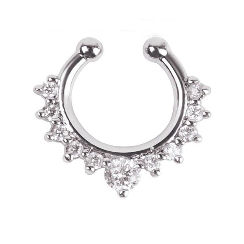 A silver-plated nose ring with a Boho design, featuring a crescent shape with shimmering crystals set within.