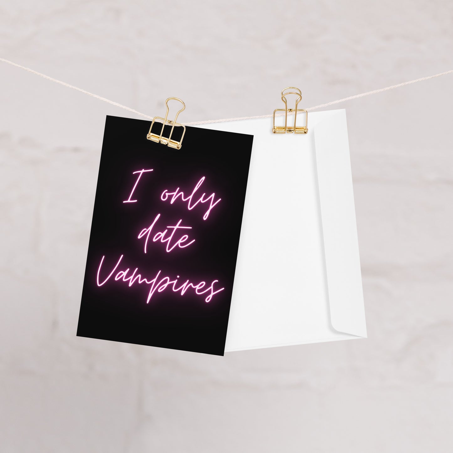 Vampire Greeting Card on a washing line hanging with gold clips.