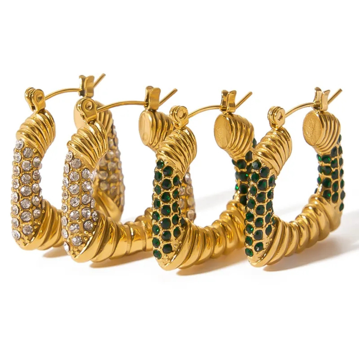 Four gold hoop earrings with twisted rope-like textures, arranged in a row on a white background. Two are embellished with clear rhinestones, and two are embellished with dark green gemstones.