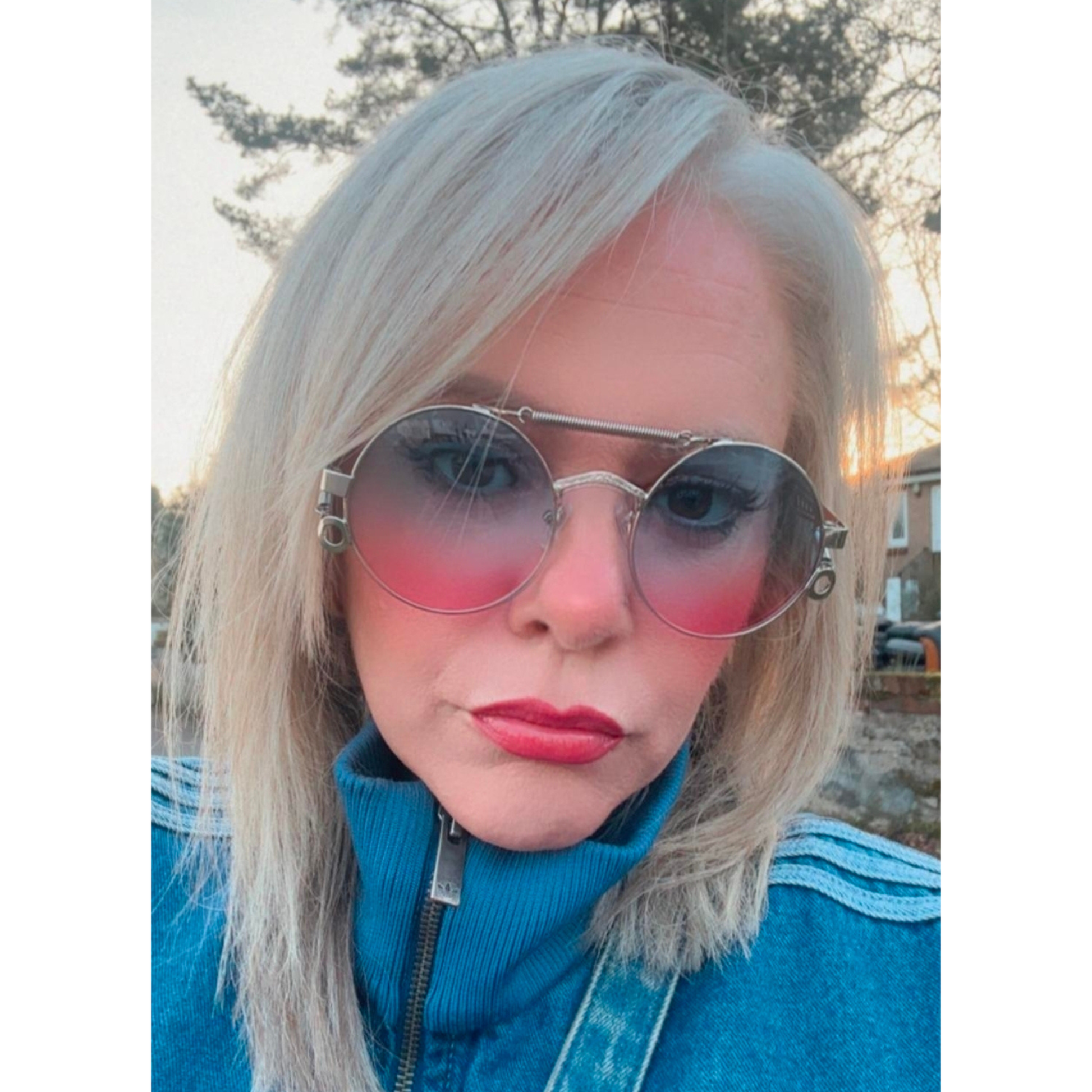 Graduated circle sunglasses with pink and blue colour on a cool chick with fabulous hair.