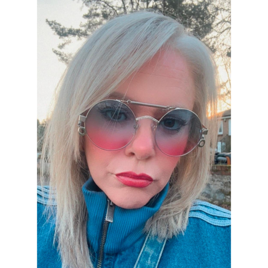 Graduated circle sunglasses with pink and blue colour on a cool chick with fabulous hair.