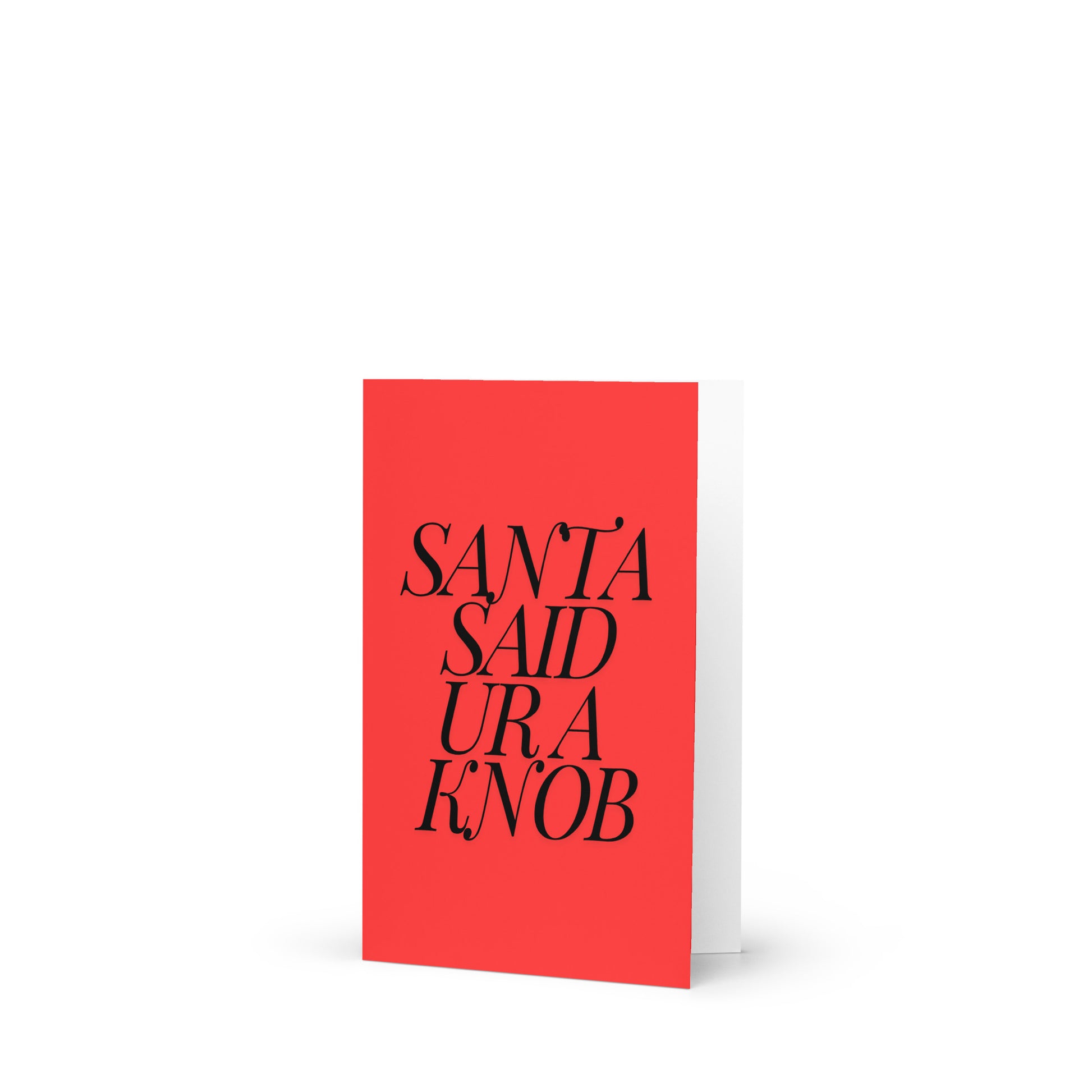A red card with 'Santa Said Ur a Knob' written in black text and a complimentary envelope.