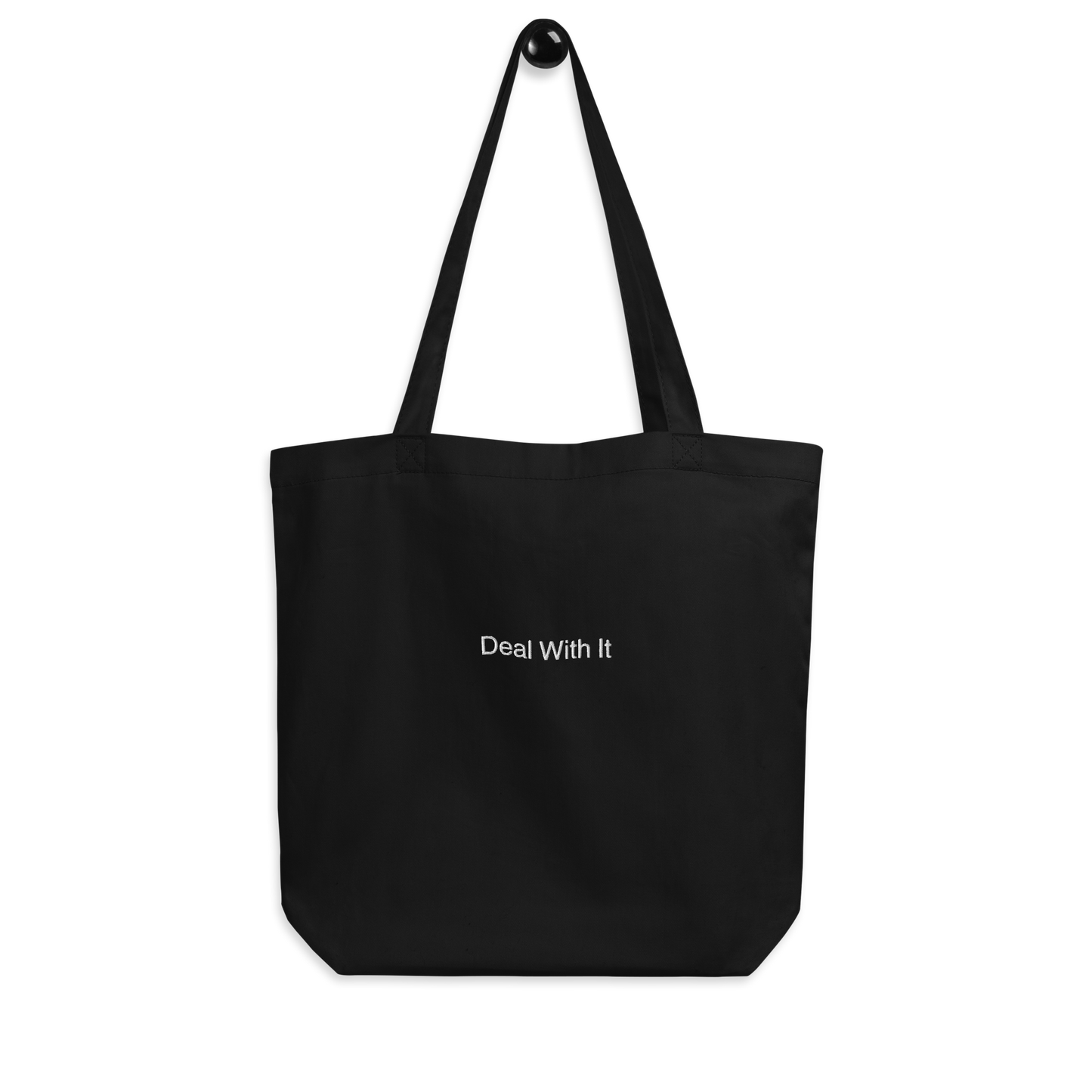 Black Deal with It Slogan embroidered eco tote bag on a blank surface.