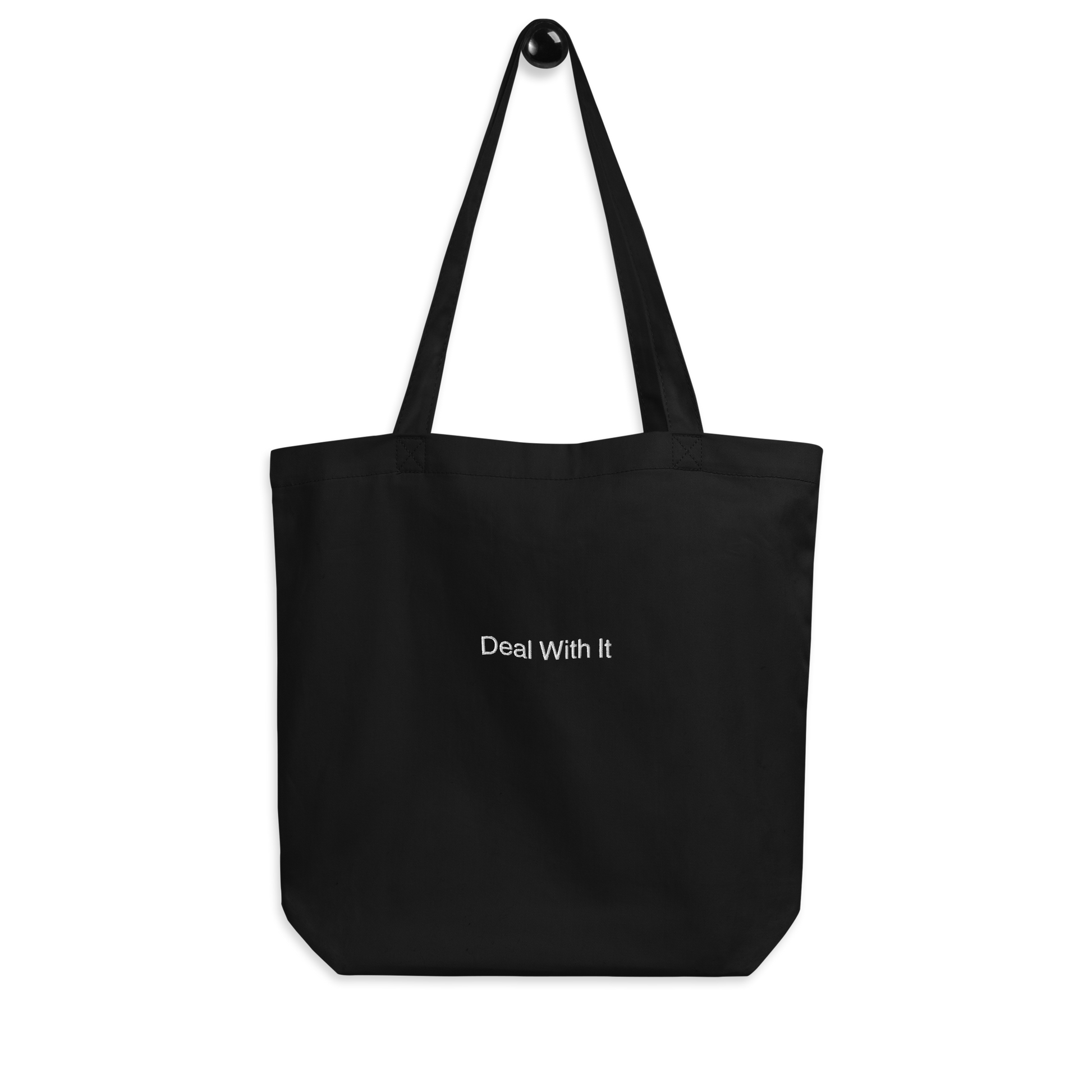 Black Deal with It Slogan embroidered eco tote bag on a blank surface.