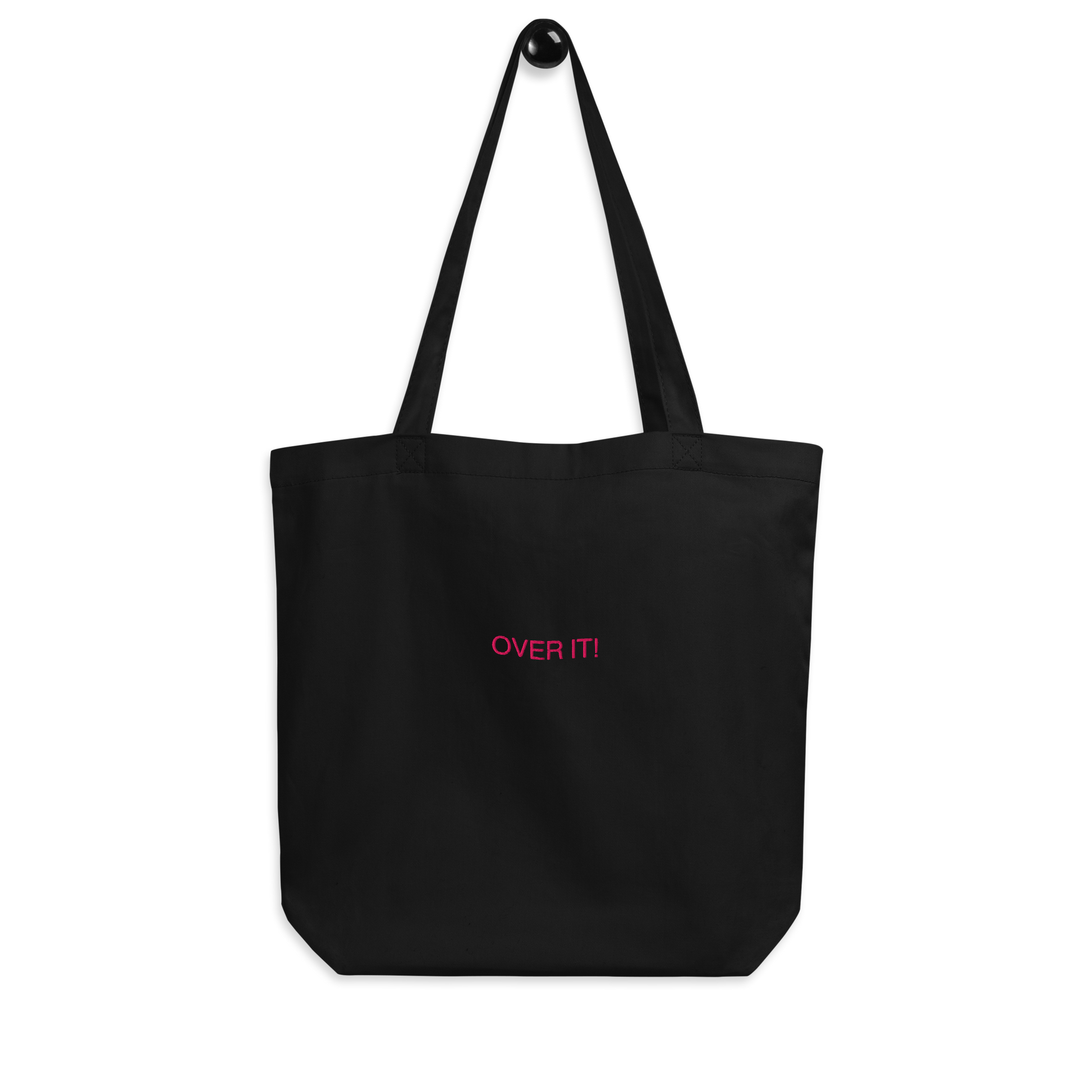 Black Over It slogan embroidered Eco Organic cotton tote bag on a blank surface.