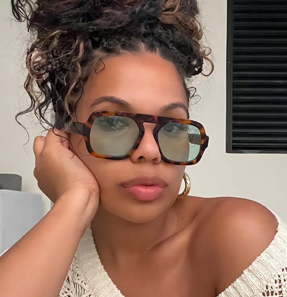 Brown Marble Retro Sunnies with Green Lenses on a beautiful black woman with amazing skin.