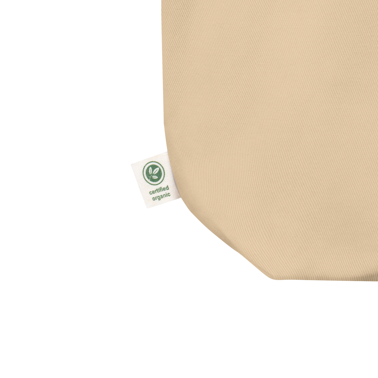 Close up of the Eco Organic cotton tote bag label on a blank surface.