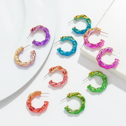 Fun neon acrylic hoops in neon colours on a white background.