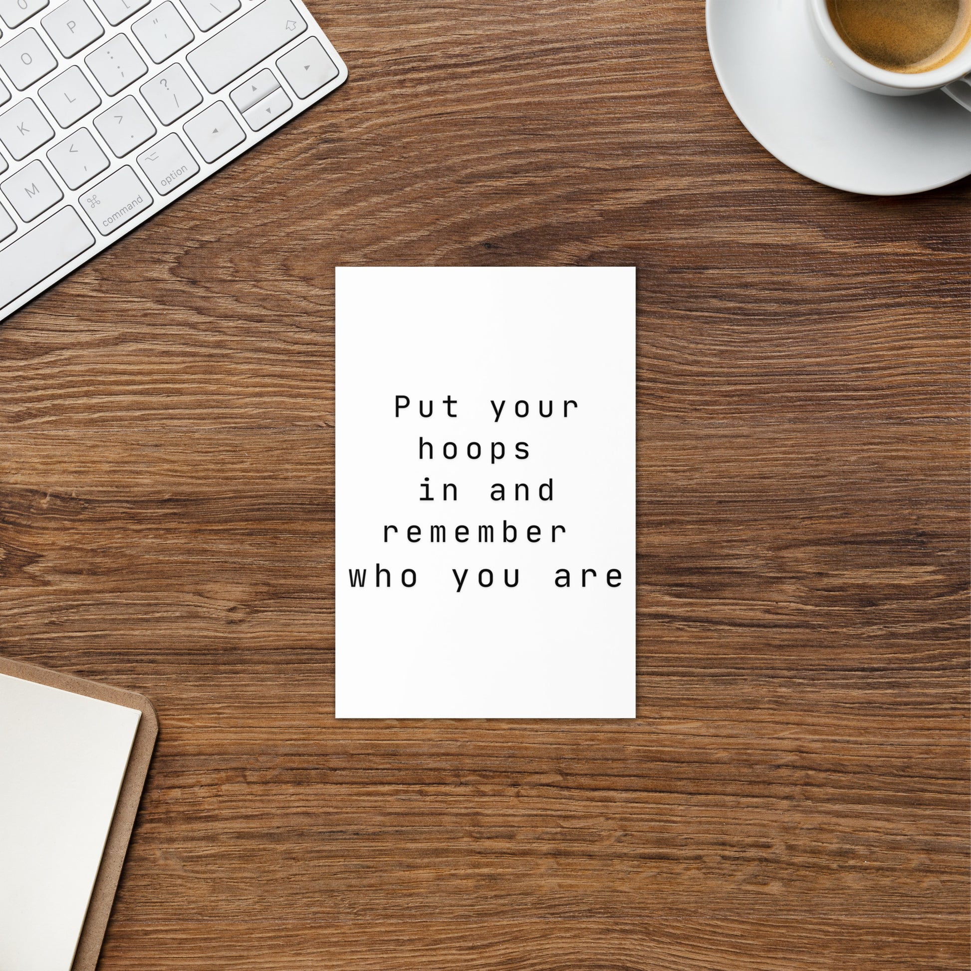 Female empowerment hoops greeting card on a office desk.