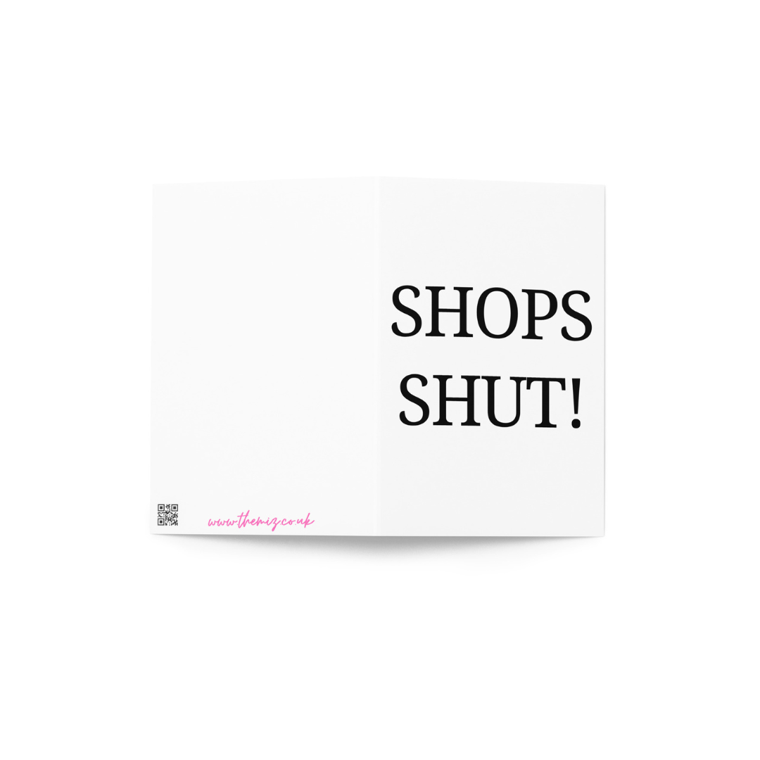 A white greeting card with the funny phrase Shops Shut! in black capital letters.