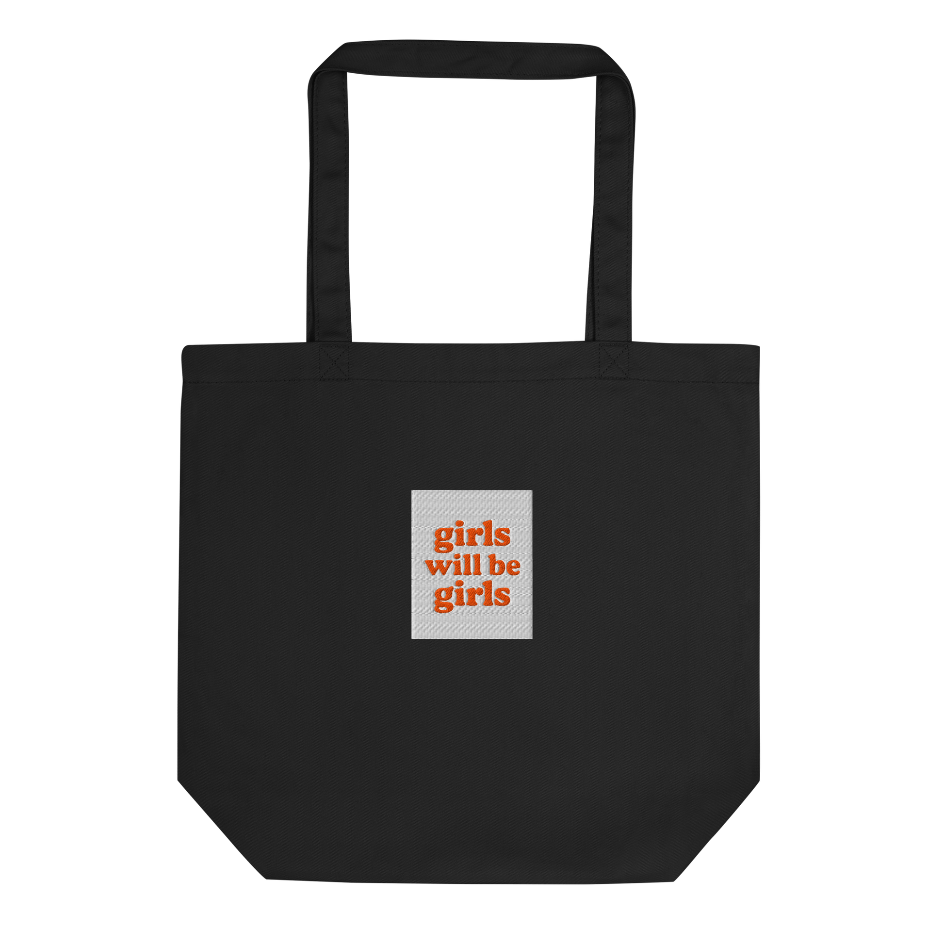 Black tote bag with a small embroidered square patch with the words girls will be girls on a white background.