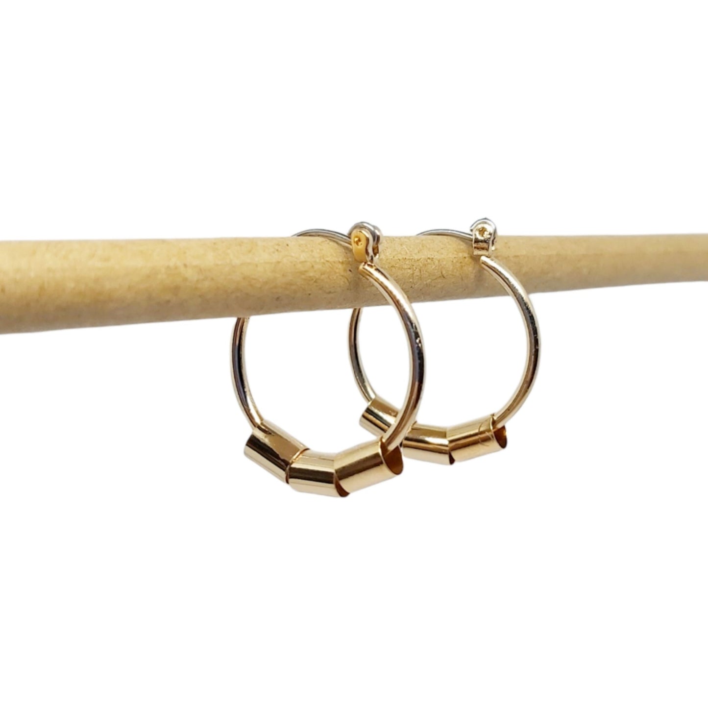 A pair of upcycled gold plated beaded hoop earrings on a white background.