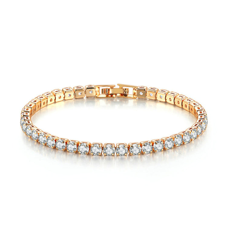 A gold-plated bracelet featuring a series of sparkling stones in a linked chain design.