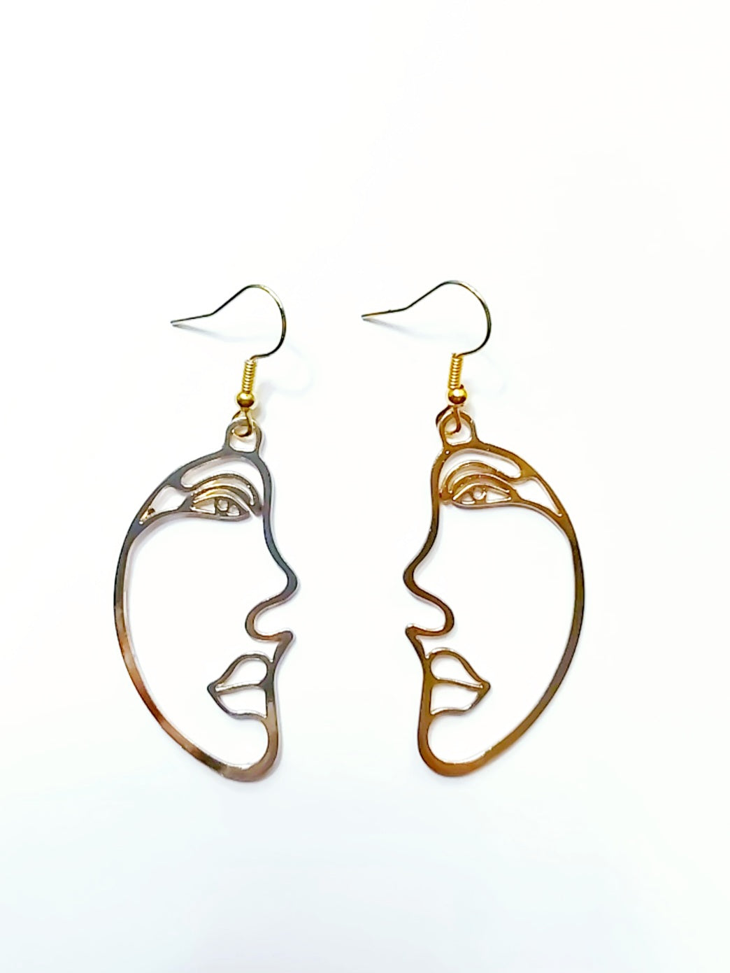 Gold Plated face 2 face drop earrings on a white background.