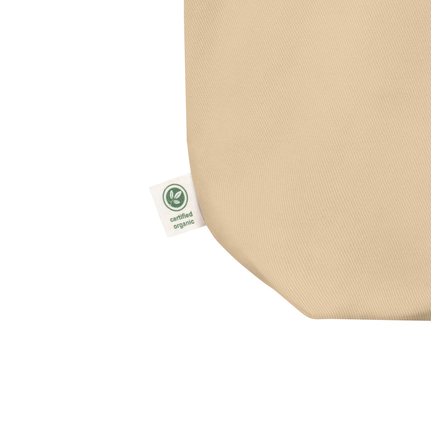 Beige It's a No from Me organic cotton Slogan embroidered eco tote bag on a blank white surface label close up.