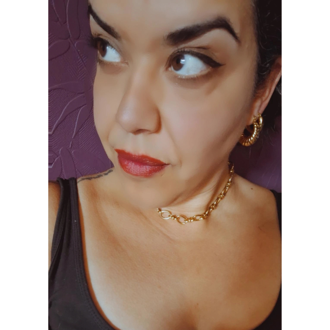 18K Gold plated stainless steel chain necklace on a pretty girl wearing a vest.