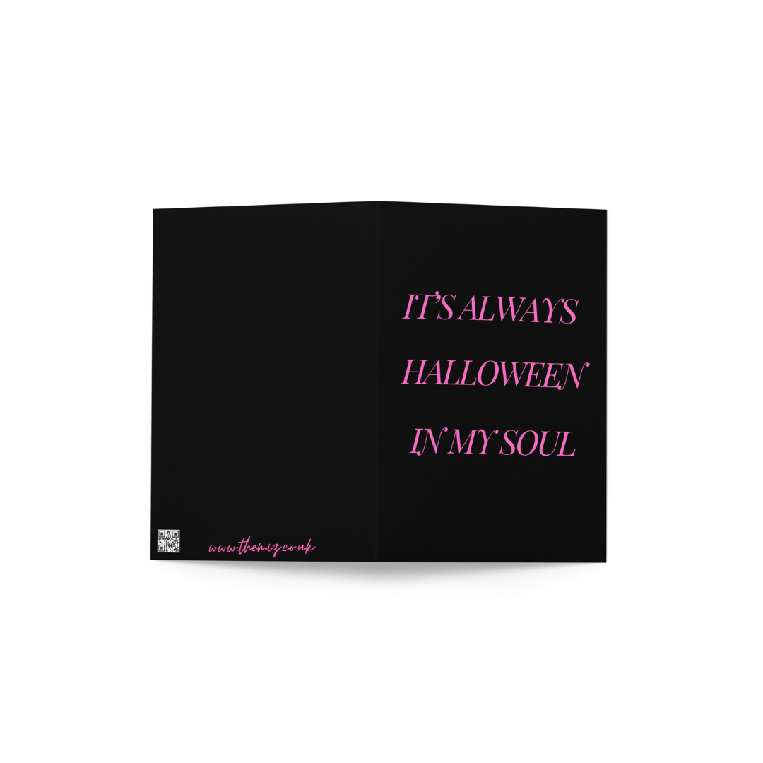 Black greeting card with pink text saying 'IT'S ALWAYS HALLOWEEN IN MY SOUL' on a white background.