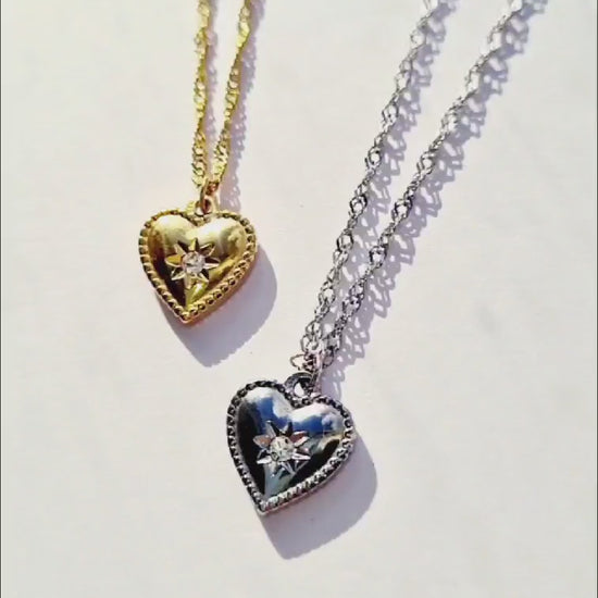 2 Gold and Silver plated stainless steel heart-shaped necklaces.