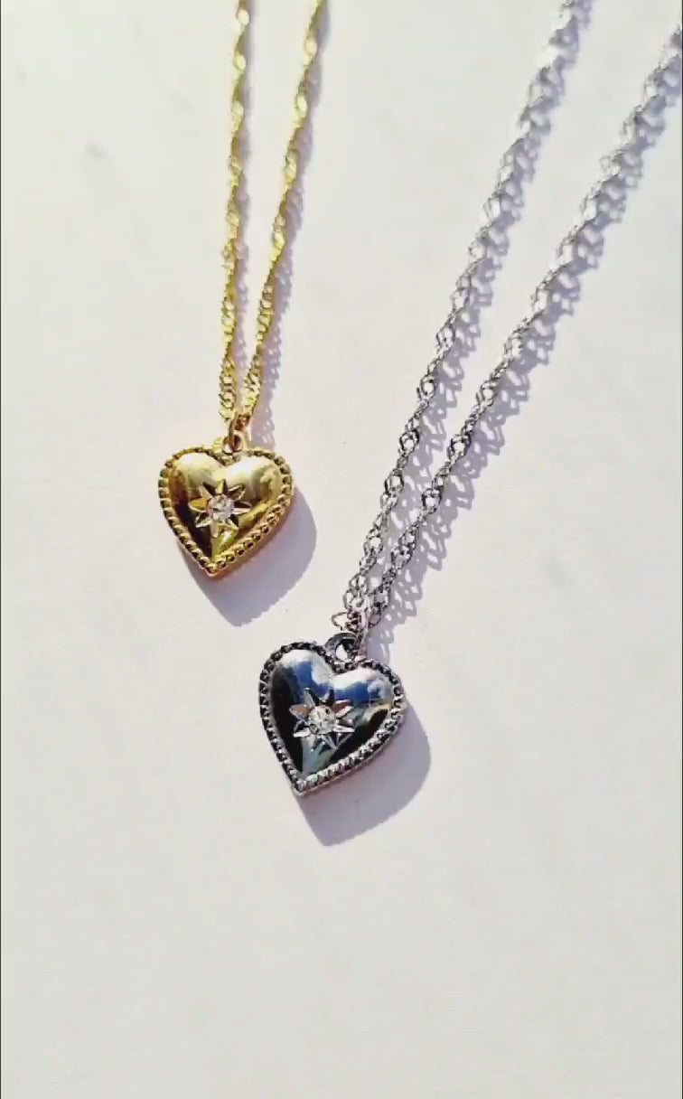 2 Gold and Silver plated stainless steel heart-shaped necklaces.